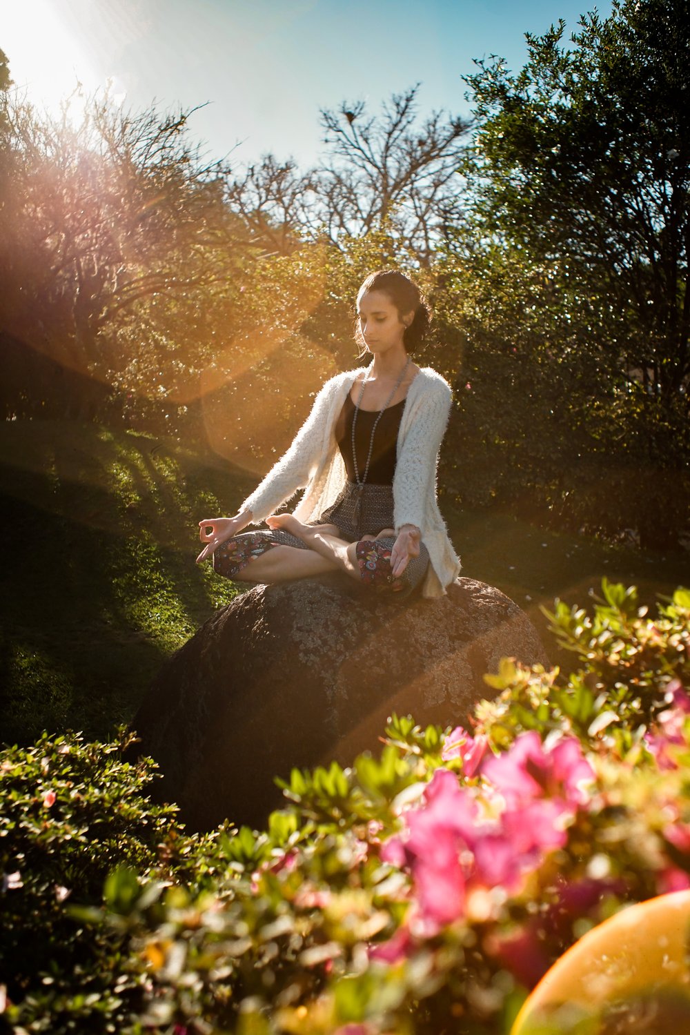rsz_woman-meditating-on-rock-2597205